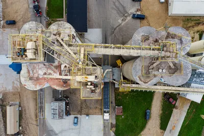 Overhead shot of an industrial facility in Winona, MN, featuring silos and machinery.